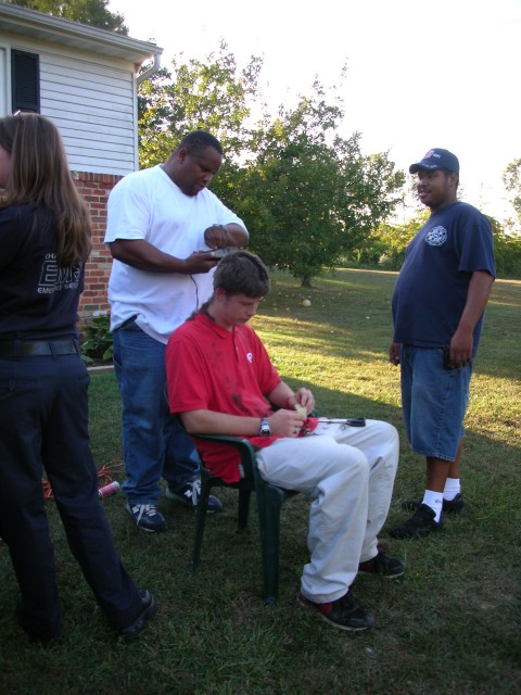 The NEWBURG barber shop is open for business with a line waiting.