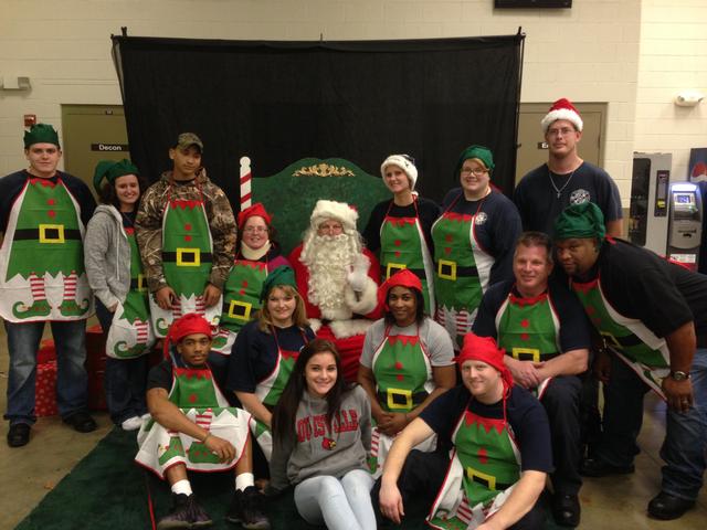 Members taking a picture with Santa for our Santa's Workshop December 2013